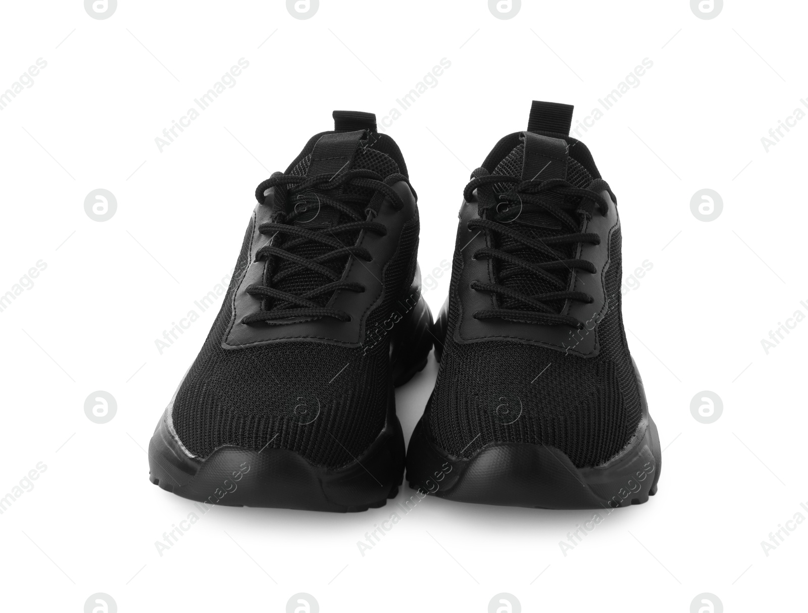 Photo of Pair of black sneakers isolated on white