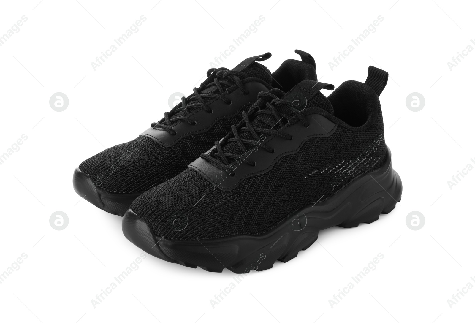 Photo of Pair of black sneakers isolated on white