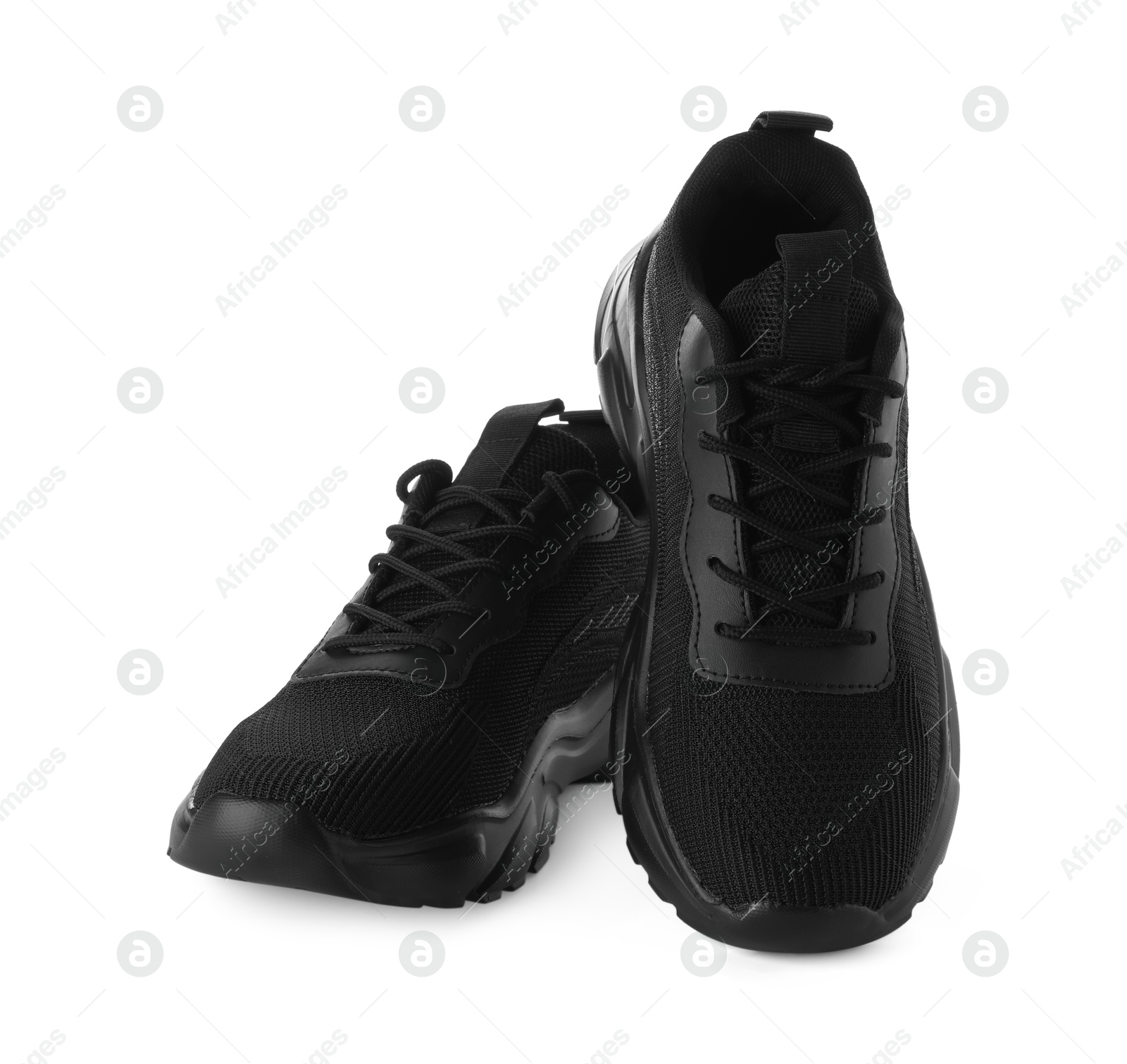 Photo of Pair of black sneakers isolated on white