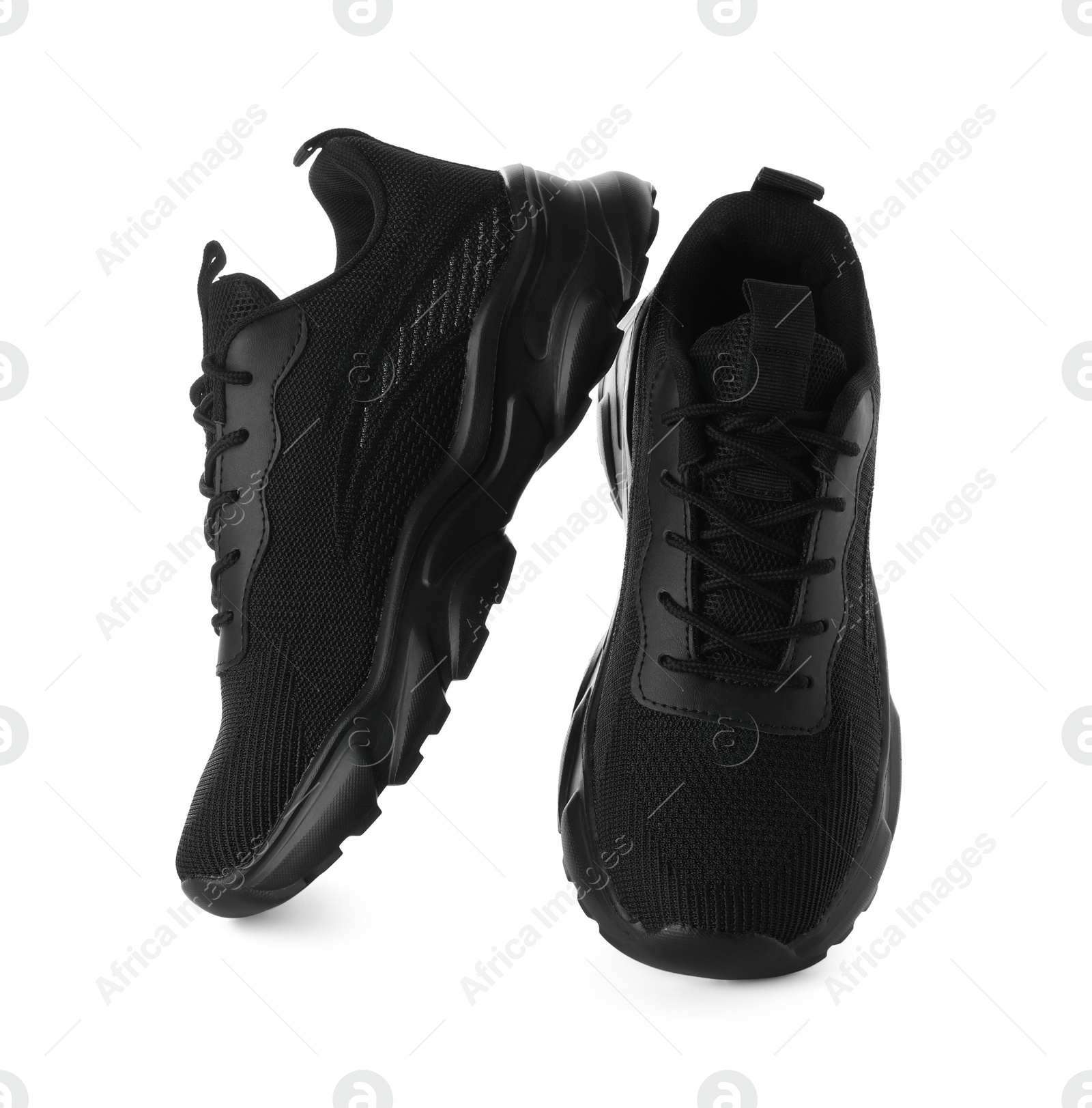 Photo of Pair of black sneakers isolated on white