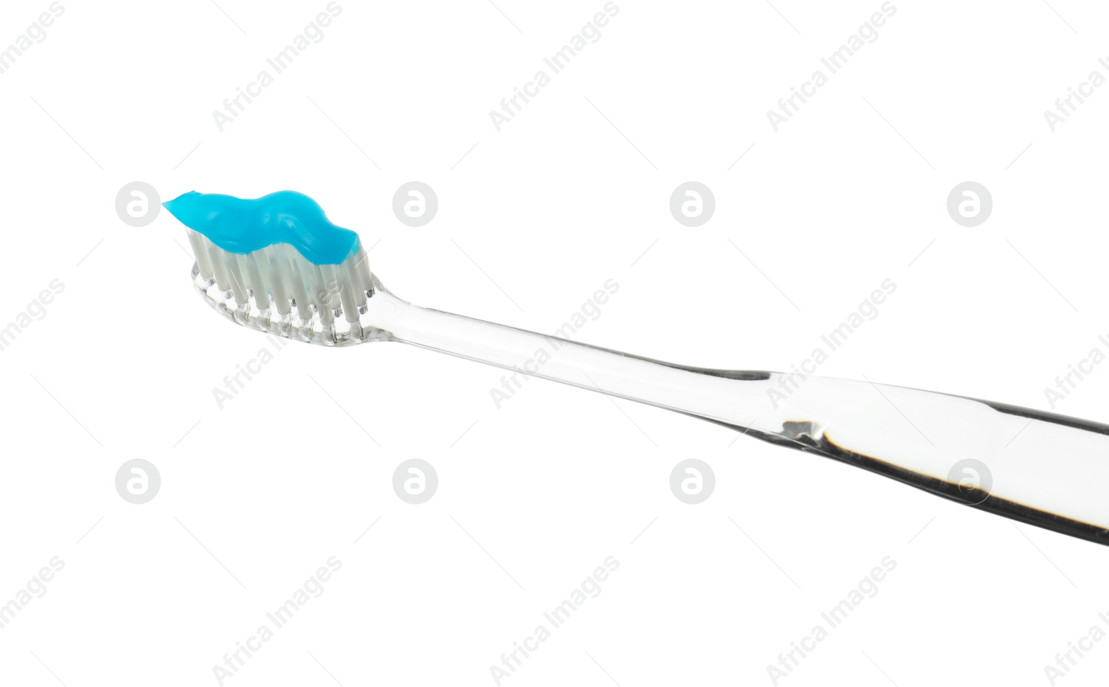 Photo of One toothbrush with toothpaste in air isolated on white