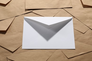 Photo of Paper envelopes as background, above view. Mockup for design