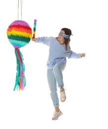 Photo of Woman with tied eyes breaking pinata on white background