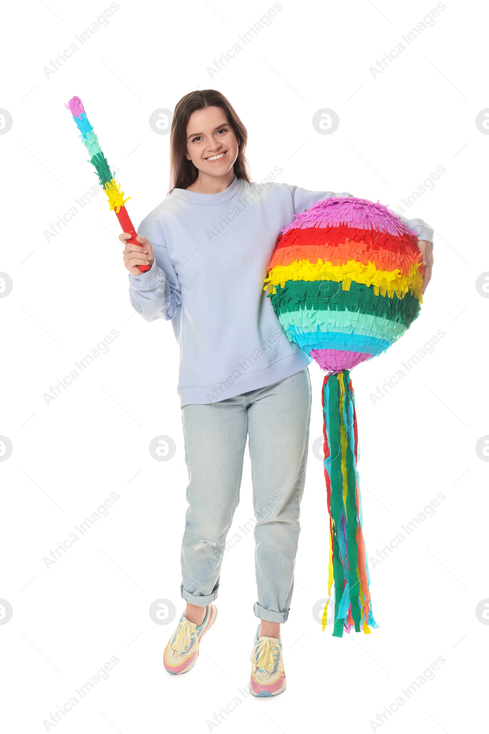 Photo of Happy woman with colorful pinata and stick on white background