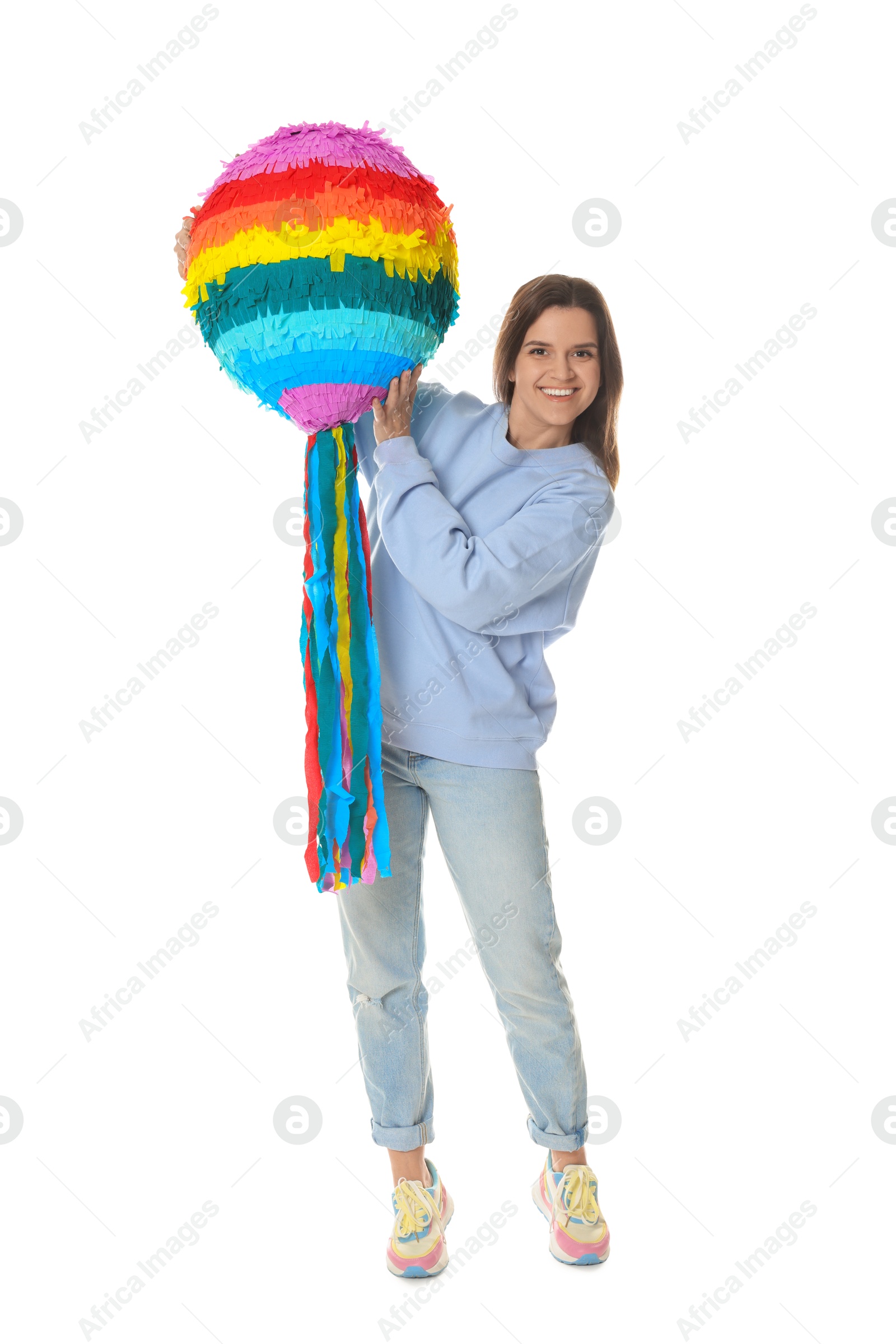 Photo of Happy woman with colorful pinata on white background