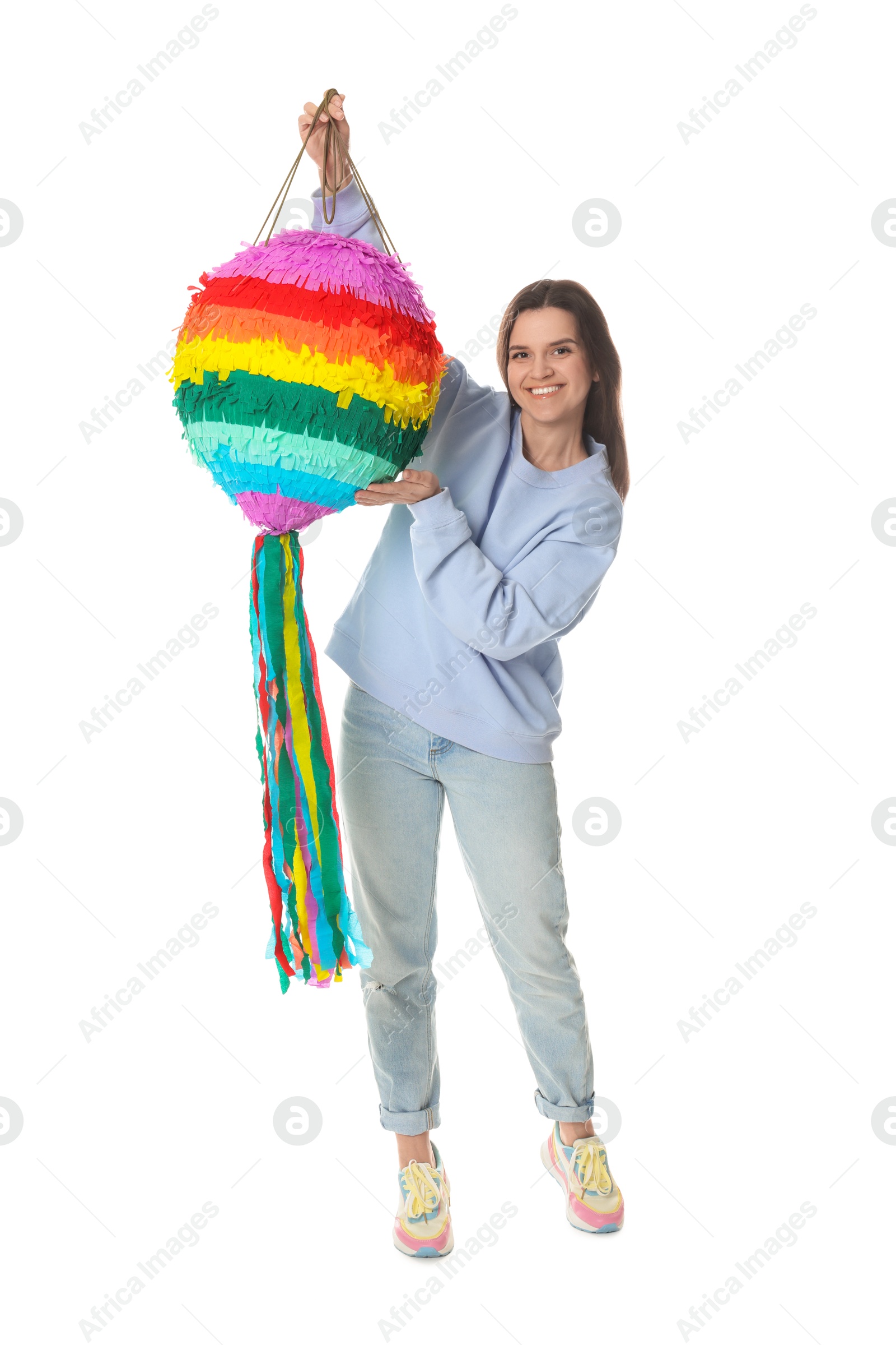 Photo of Happy woman with colorful pinata and stick on white background