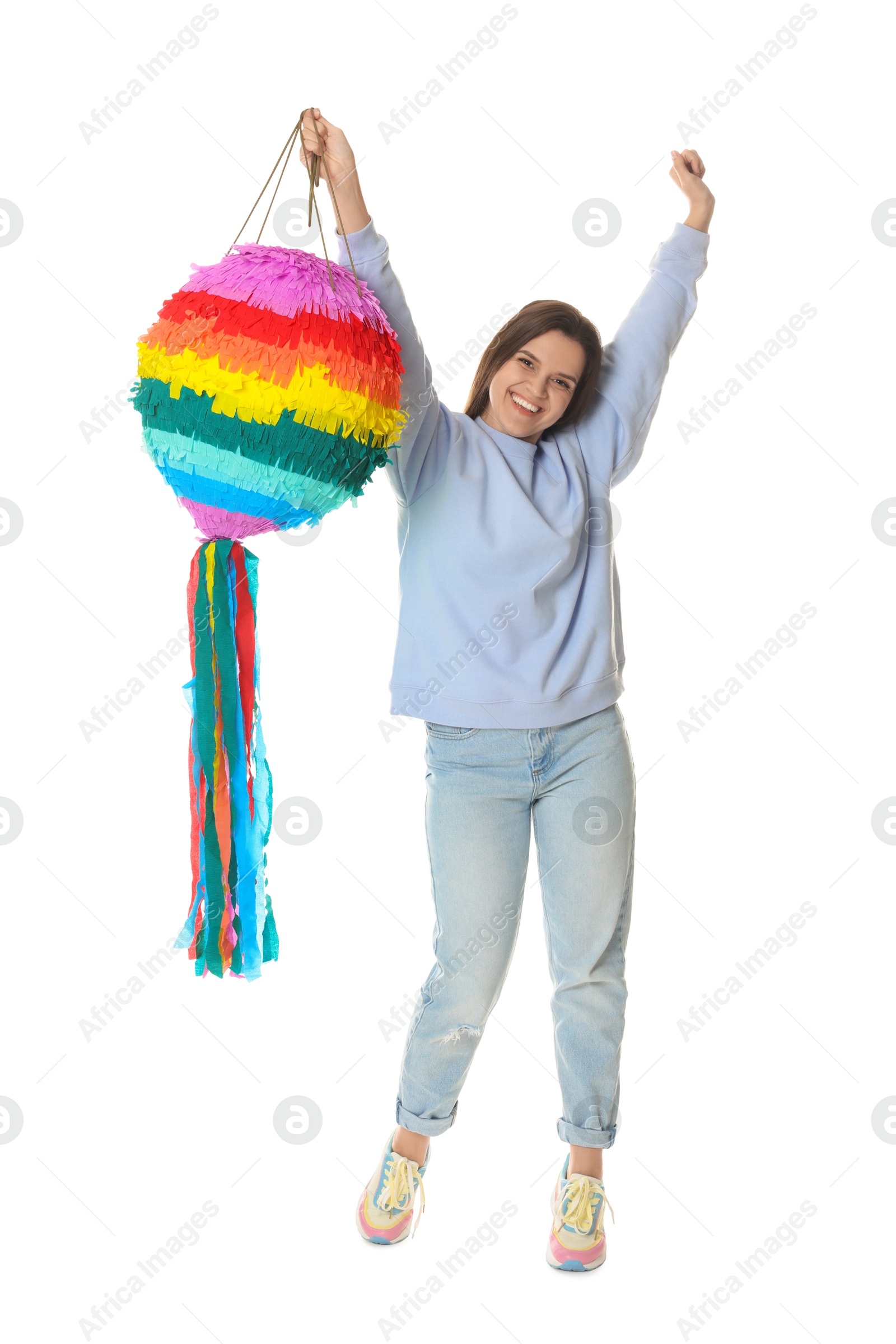 Photo of Happy woman with colorful pinata and stick on white background