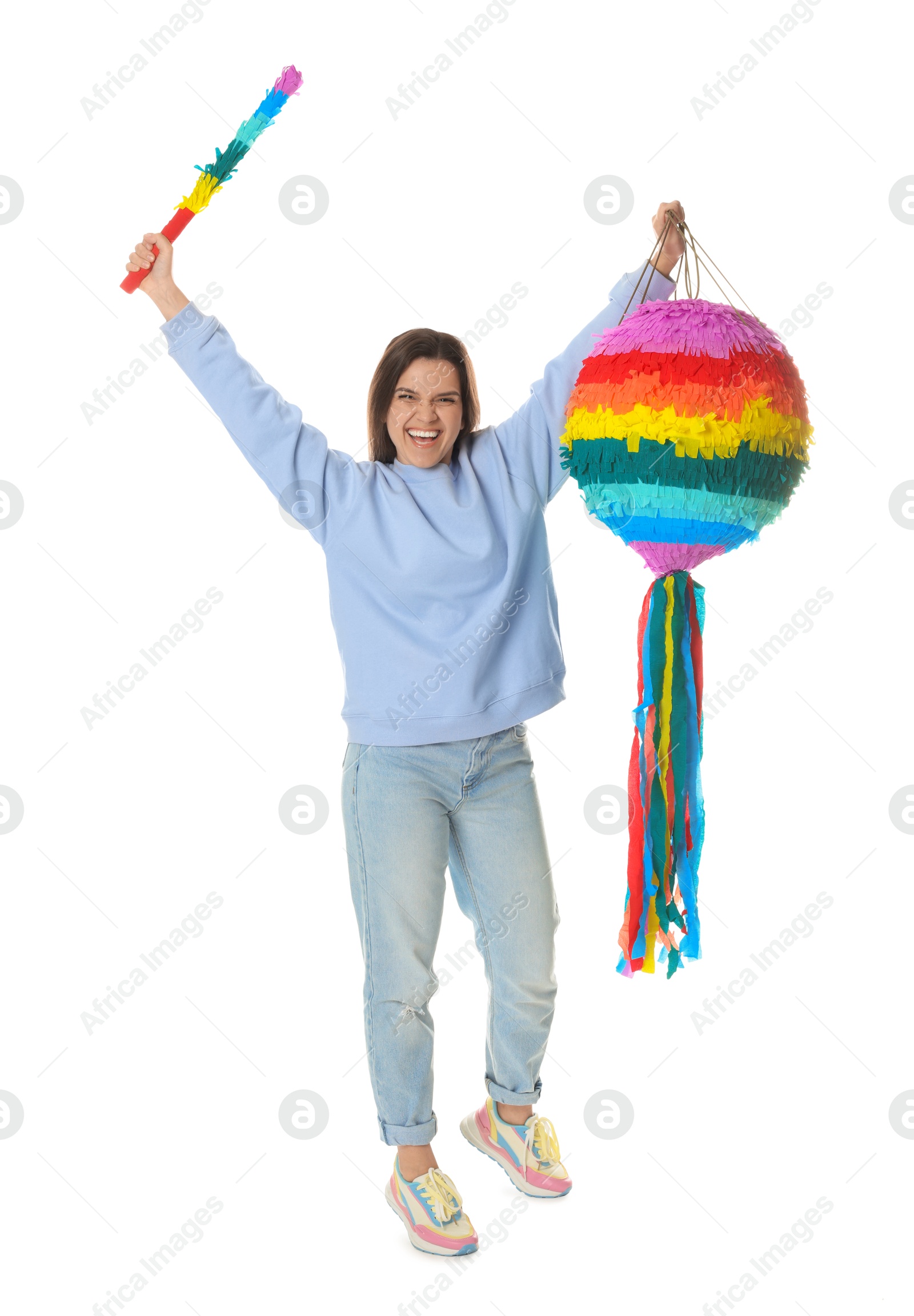 Photo of Happy woman with colorful pinata and stick on white background