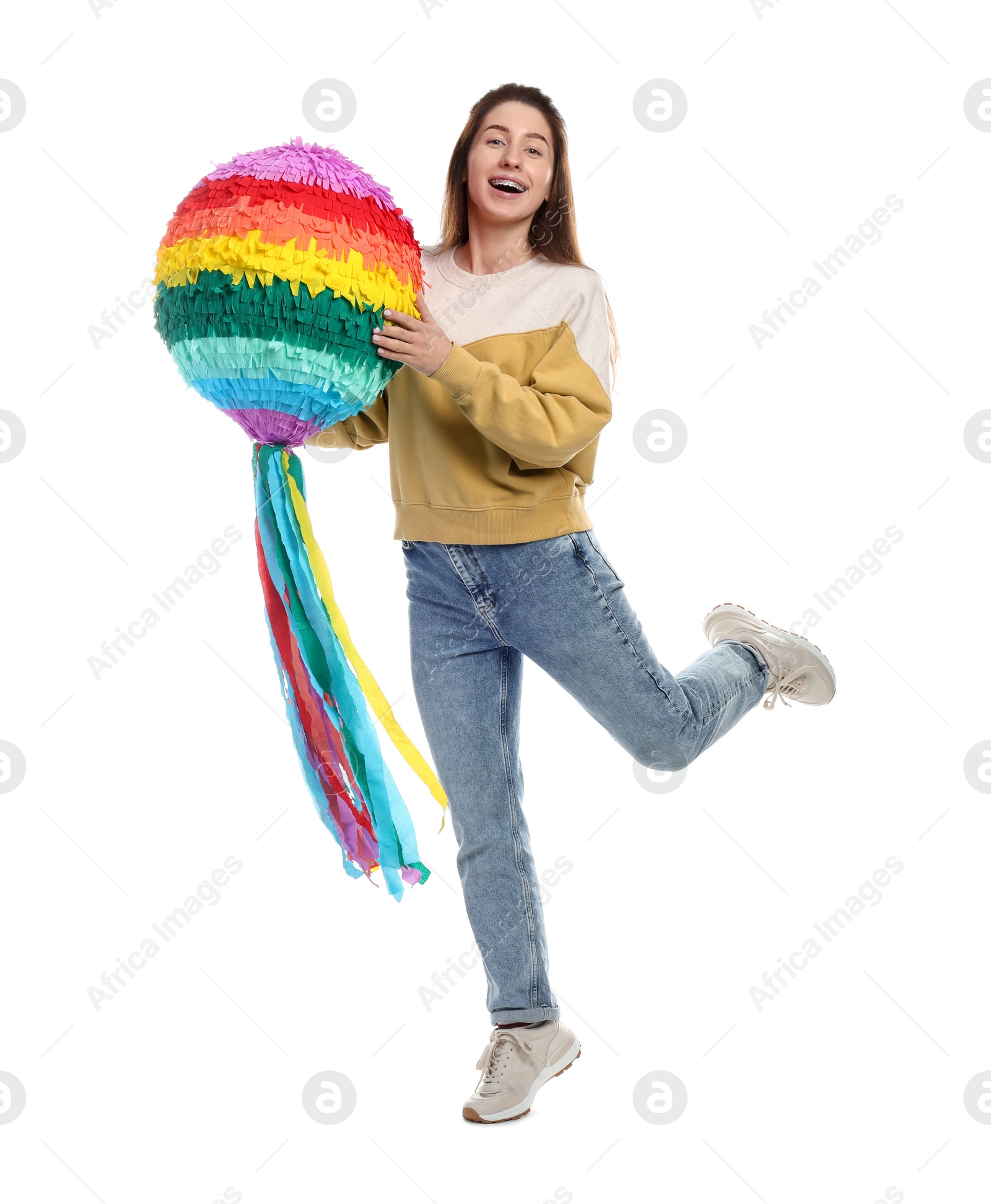 Photo of Happy woman with colorful pinata on white background