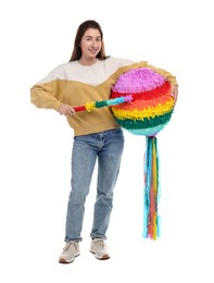 Photo of Happy woman with colorful pinata and stick on white background