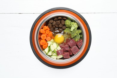 Photo of Dry pet food and natural products on white table, top view