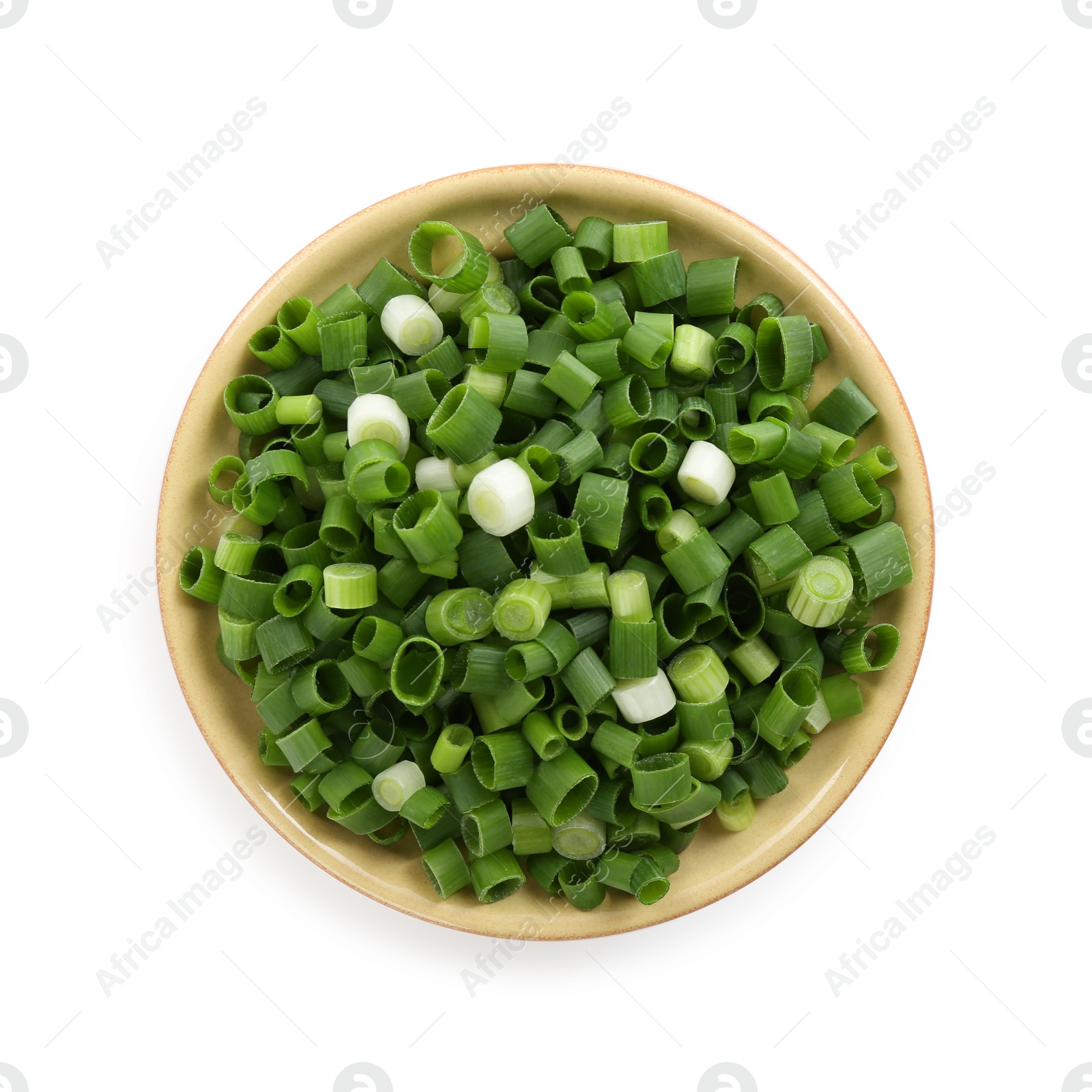 Photo of Chopped fresh green onion in bowl isolated on white, top view