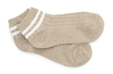 Photo of Pair of soft socks isolated on white, top view