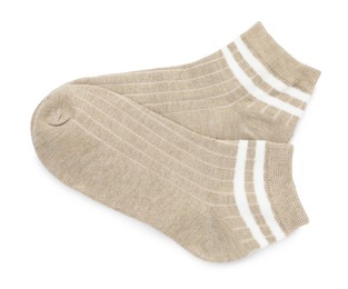 Photo of Pair of soft socks isolated on white, top view