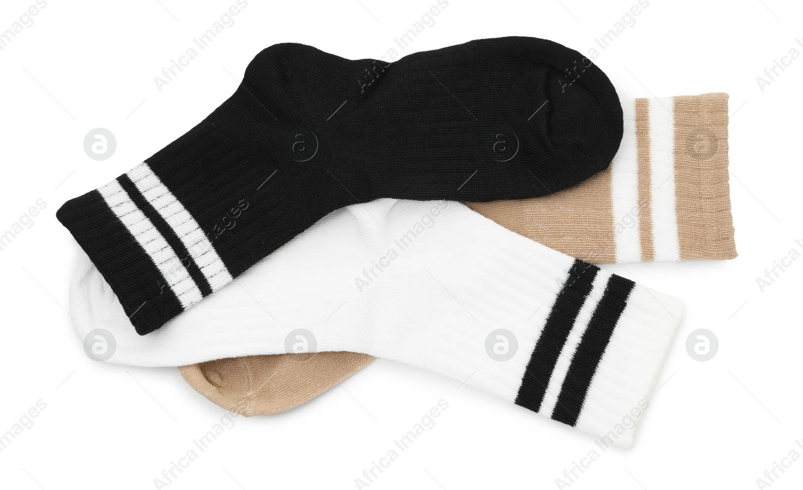 Photo of Pairs of soft socks isolated on white, top view