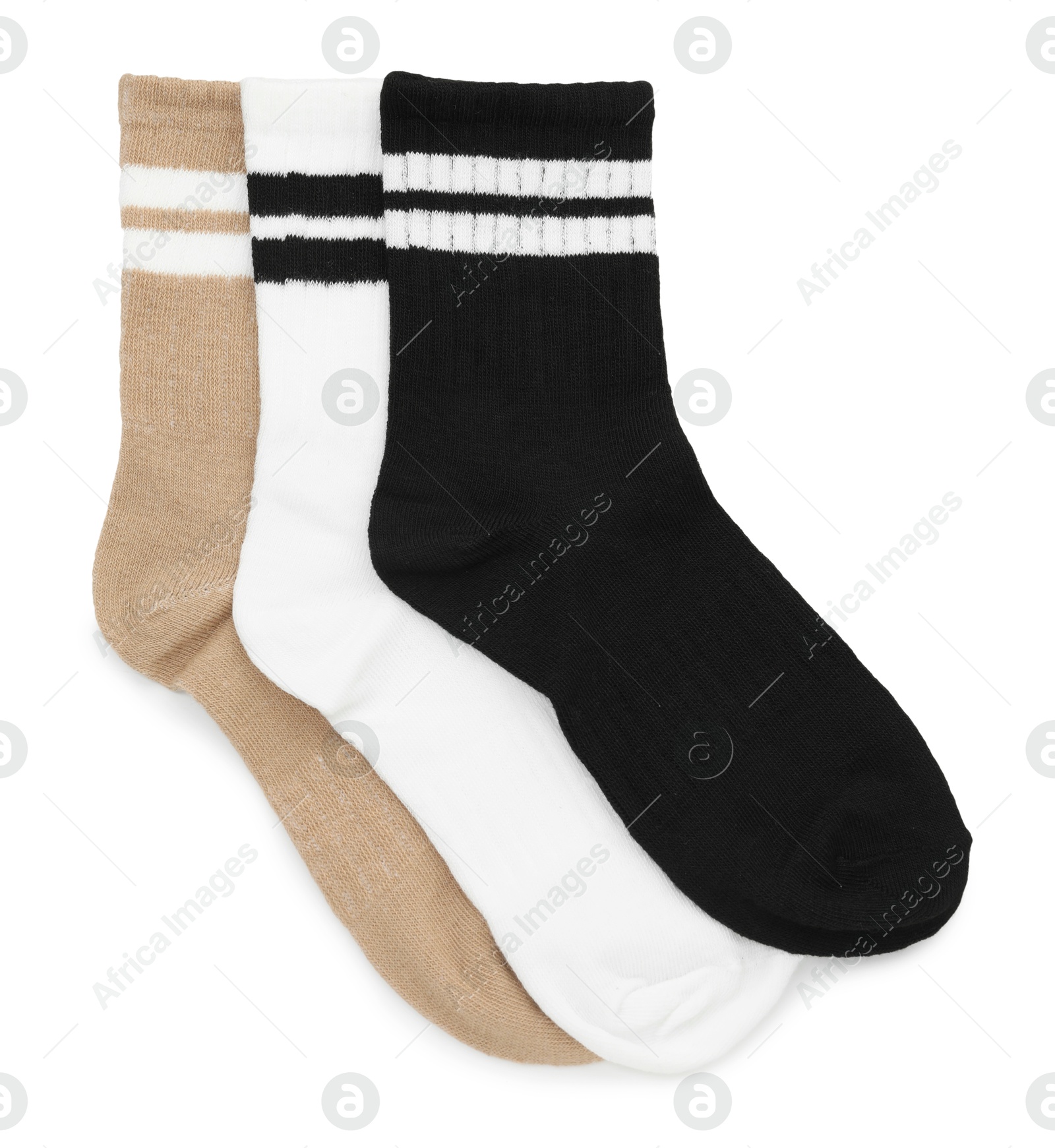 Photo of Pairs of soft socks isolated on white, top view