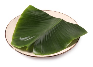 Photo of Plate with cut banana leaf isolated on white. Healthy eco serving