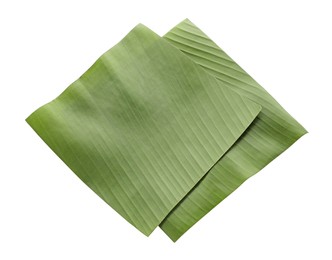 Photo of Pieces of banana leaves isolated on white. Traditional meal serving