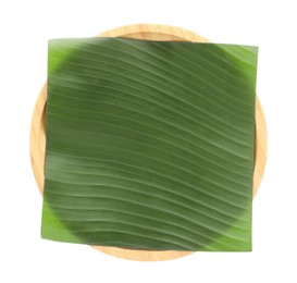 Photo of Piece of banana leaf isolated on white, top view. Traditional meal serving