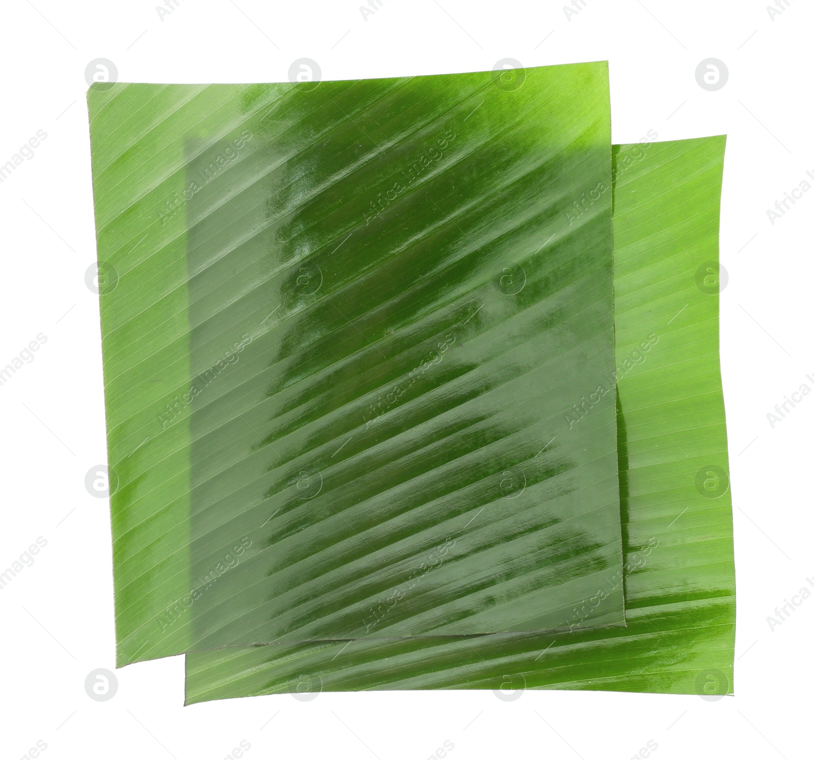 Photo of Pieces of banana leaves isolated on white, top view. Traditional meal serving