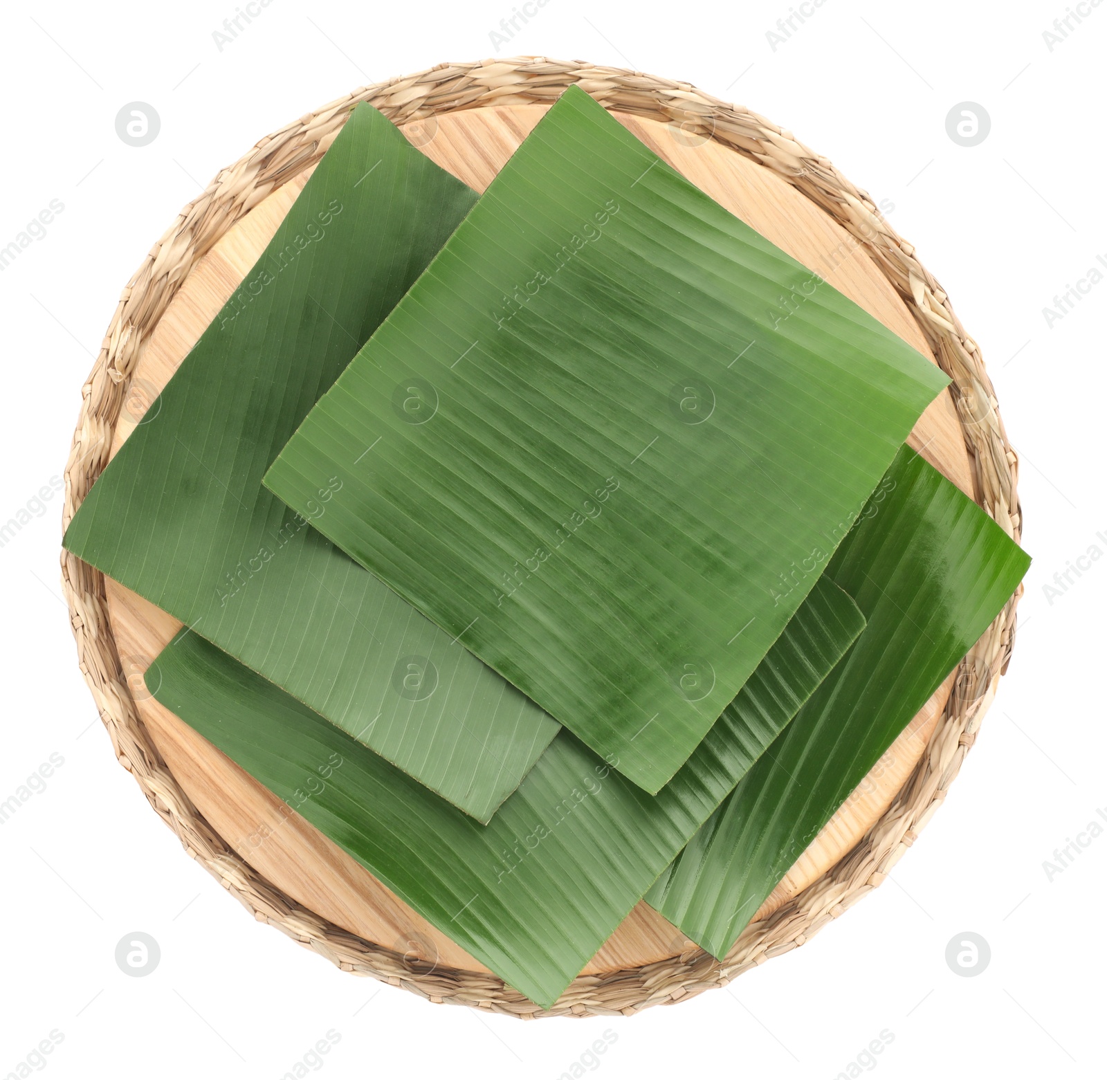 Photo of Pieces of banana leaves isolated on white, top view. Traditional meal serving