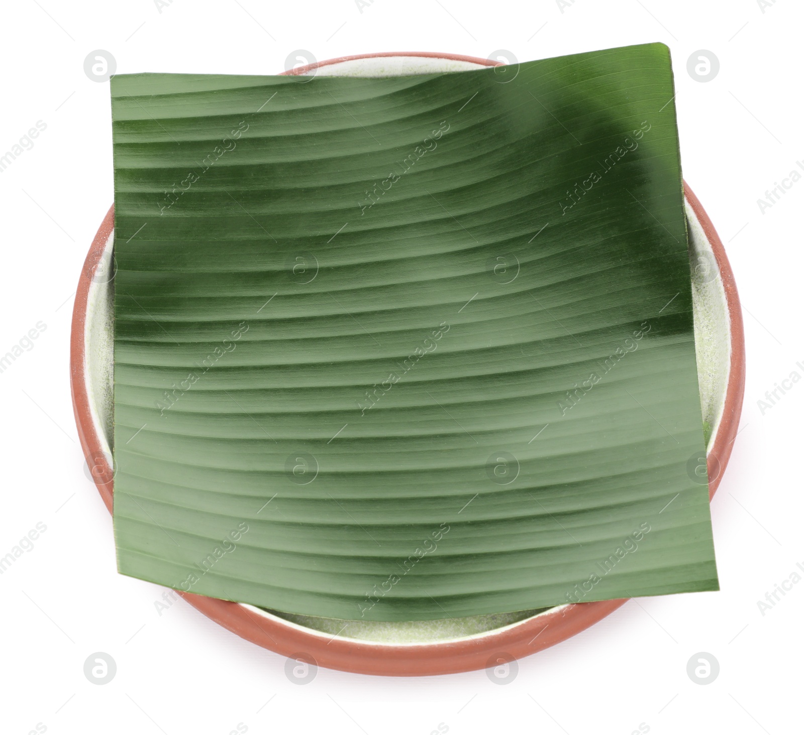 Photo of Piece of banana leaf isolated on white. Traditional meal serving