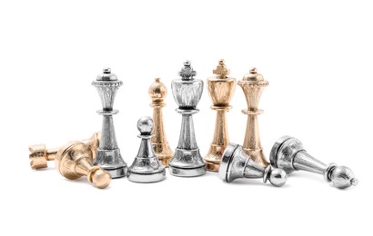 Photo of Golden and silver chess pieces on white background. Competition concept