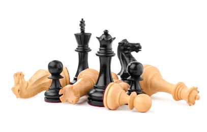 Photo of Black chess pieces among fallen white ones on white background. Competition concept