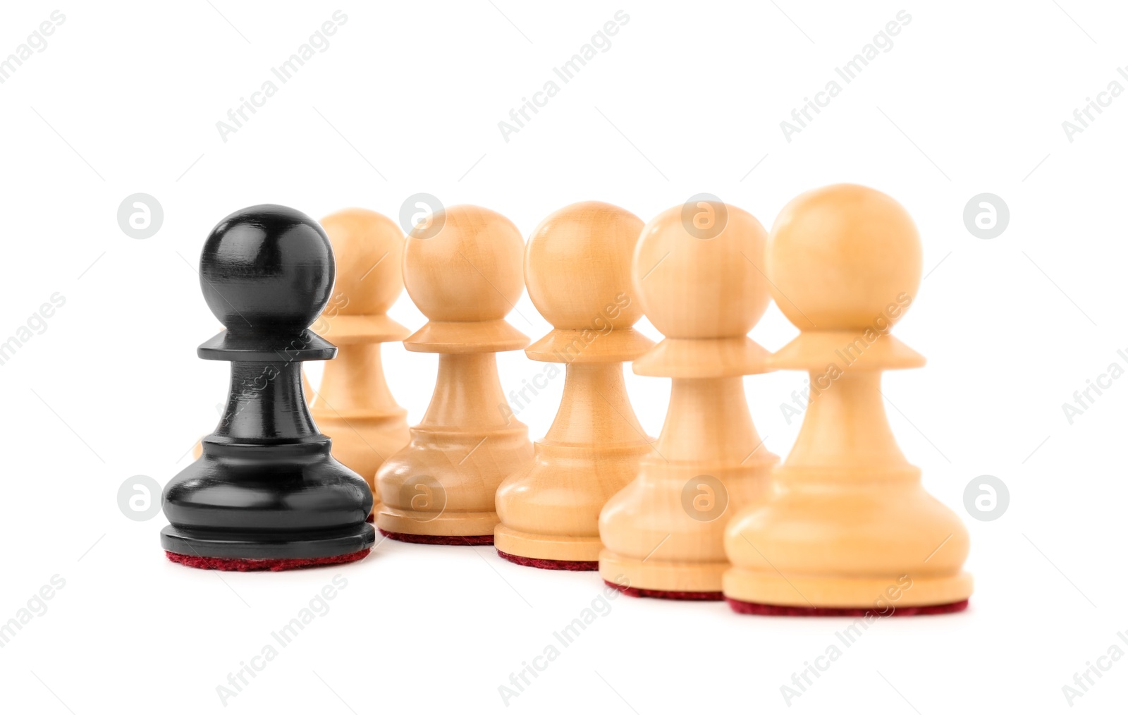 Photo of Black pawn in front of white ones isolated on white. Competition concept