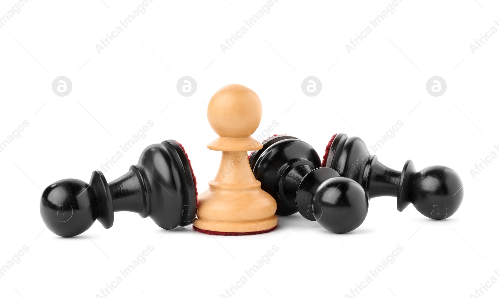 Photo of White pawn among fallen black ones on white background. Competition concept