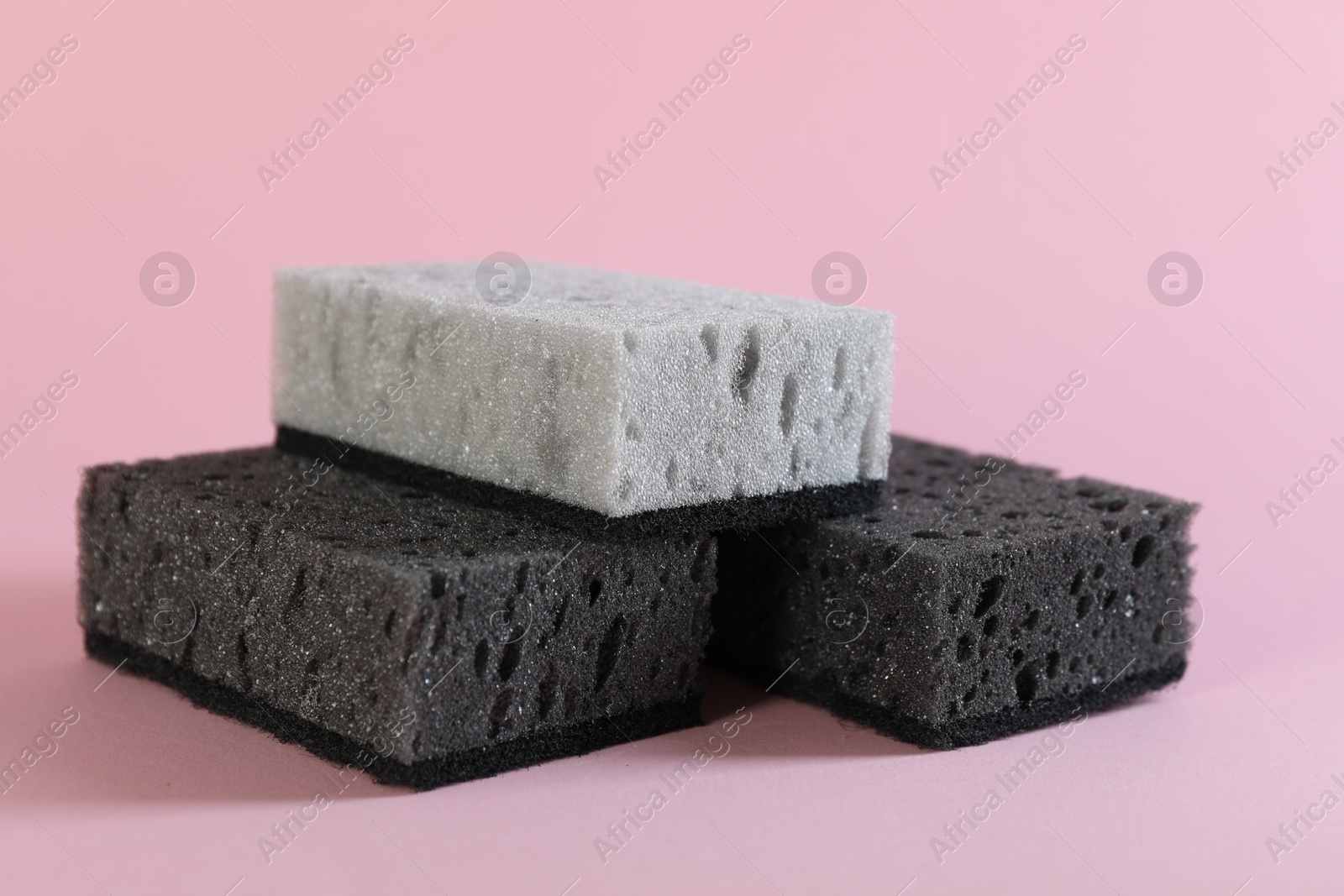 Photo of Different clean sponges on pink background, closeup