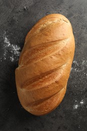 Photo of Freshly baked bread on grey table, top view