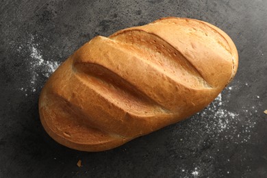 Photo of Freshly baked bread on grey table, top view