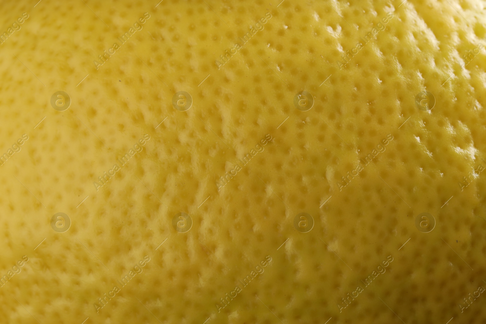 Photo of Fresh lemon zest as background, macro view