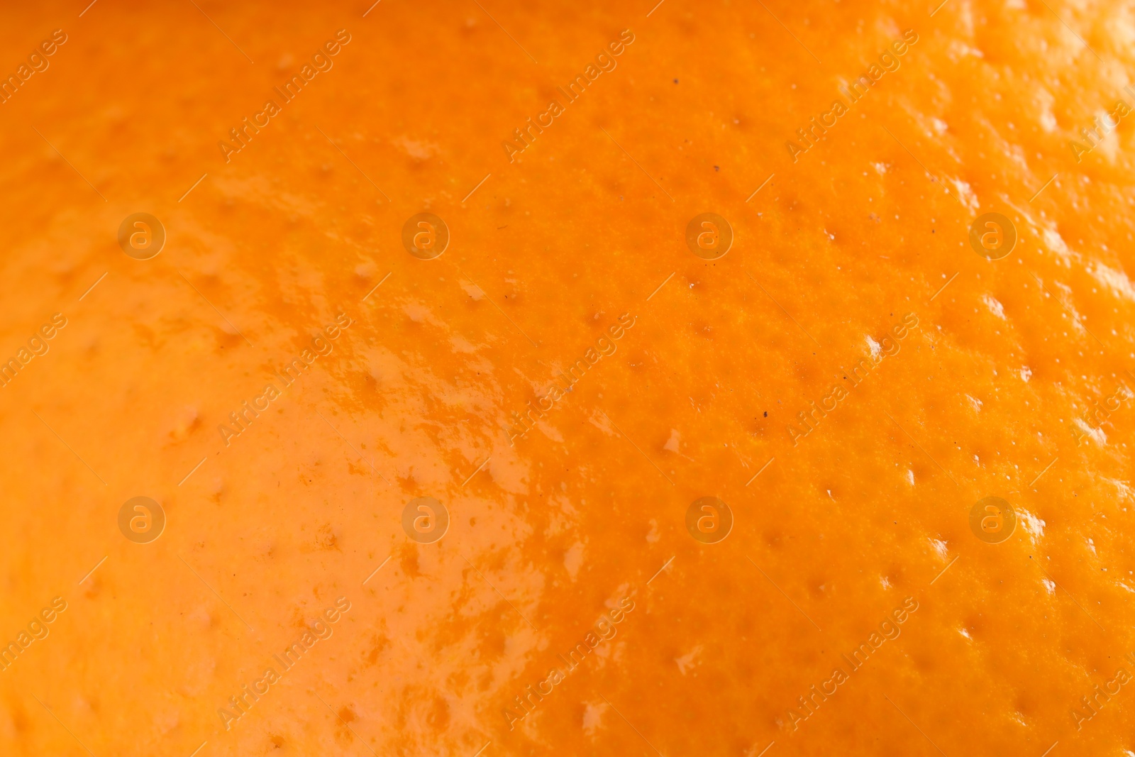 Photo of Fresh orange peel as background, macro view