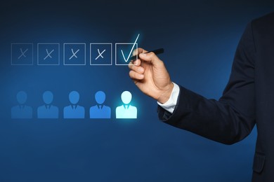 Image of Human resource. Businessman choosing one virtual figure among others on blue background, closeup