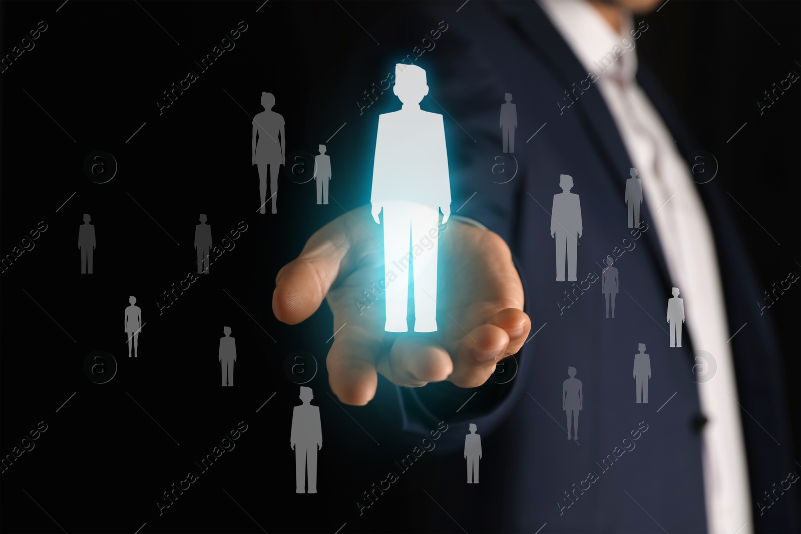 Image of Human resource. Businessman choosing one virtual figure among others on black background, closeup