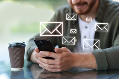 Image of Man using mobile phone at outdoor cafe, closeup. New message notification near device. Illustration of envelope