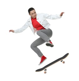 Image of Beautiful woman with skateboard in air on white background. Performing trick