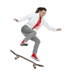 Image of Beautiful woman with skateboard in air on white background. Performing trick