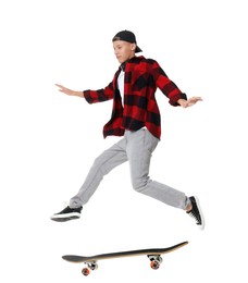 Image of Handsome man with skateboard in air on white background. Performing trick