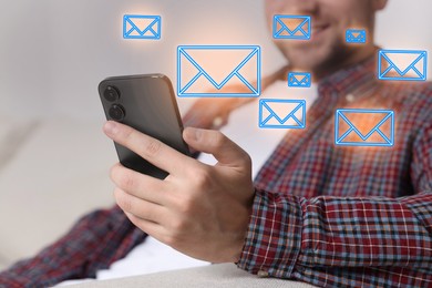 Image of Man using mobile phone indoors, closeup. New message notification near device. Illustration of envelope