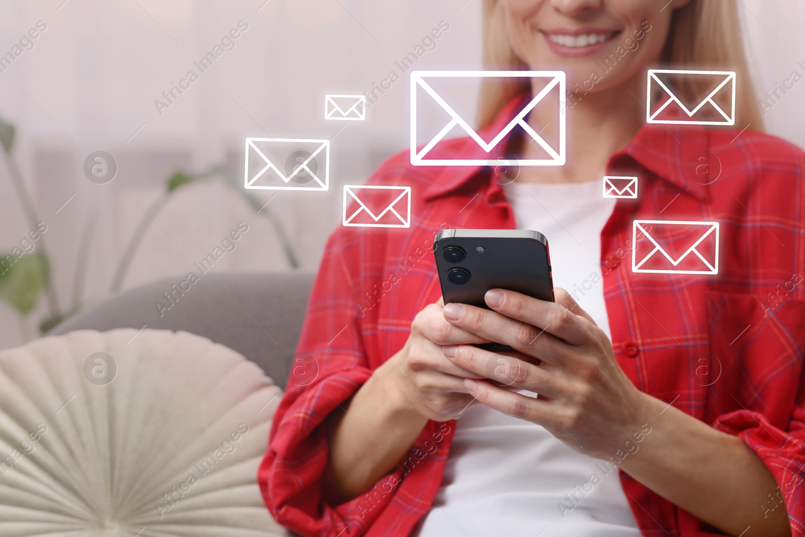 Image of Woman using mobile phone indoors, closeup. New message notification near device. Illustration of envelope