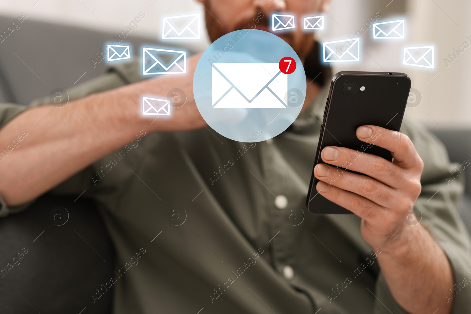 Image of Man using mobile phone indoors, closeup. New message notification near device. Illustration of envelope