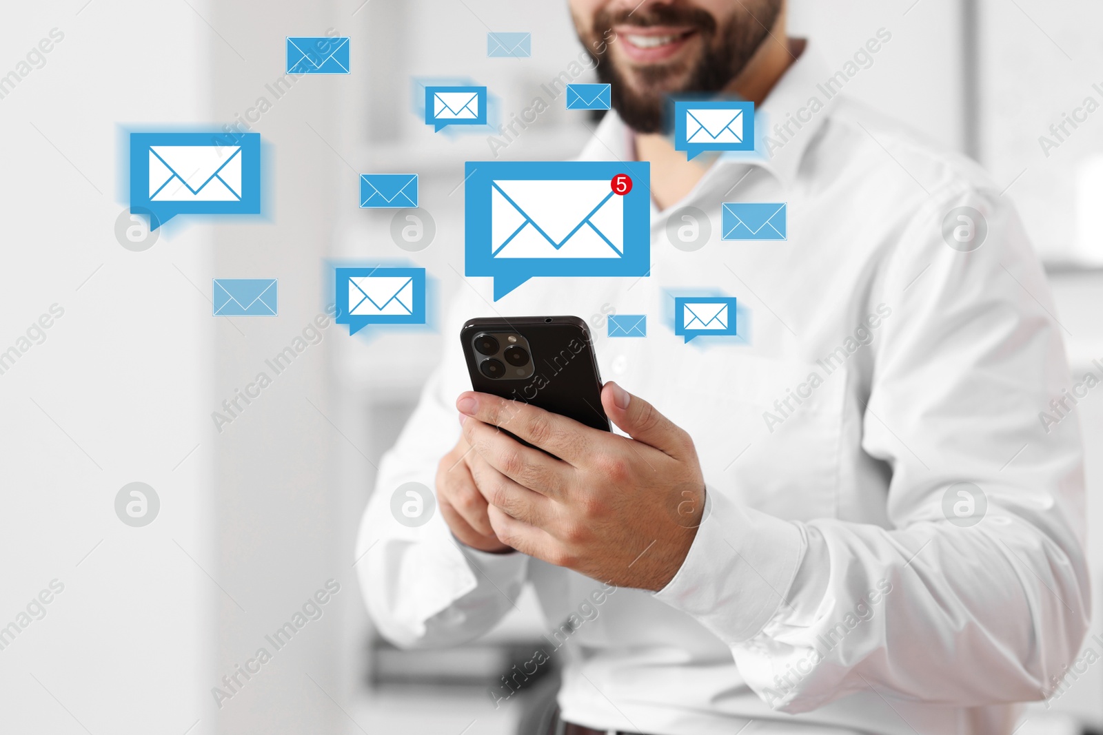 Image of Man using mobile phone indoors, closeup. New message notification near device. Illustration of envelope