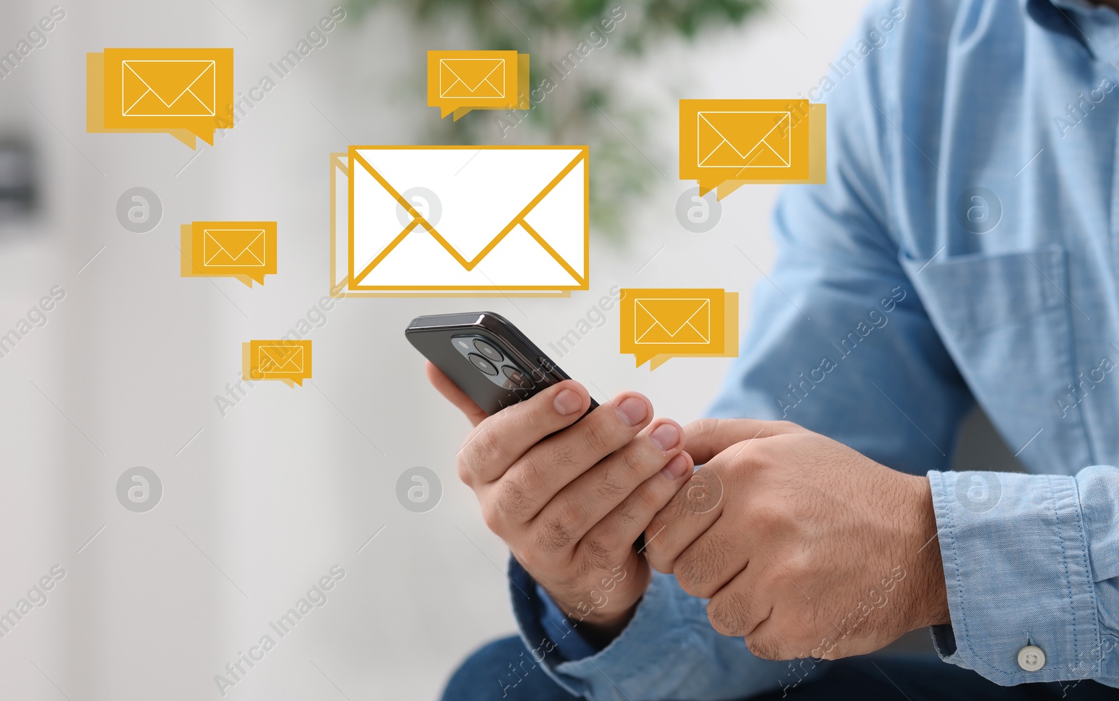 Image of Man using mobile phone indoors, closeup. New message notification near device. Illustration of envelope