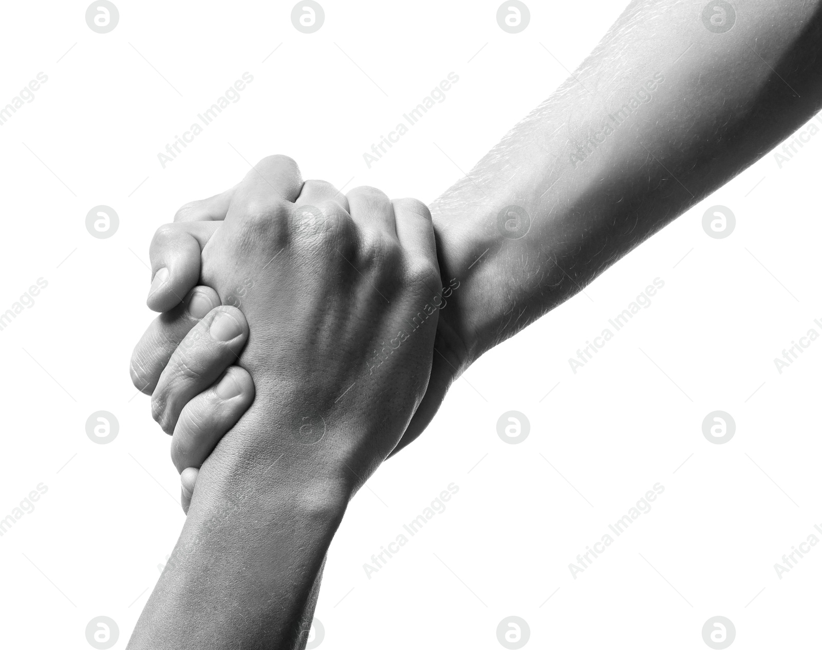 Image of Help and support. People holding hands on white background, closeup. Toned in black and white