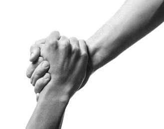 Image of Help and support. People holding hands on white background, closeup. Toned in black and white