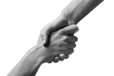 Image of Help and support. People holding hands on white background, closeup. Toned in black and white