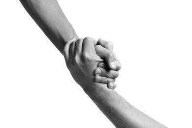 Image of Help and support. People holding hands on white background, closeup. Toned in black and white